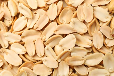 Fresh peeled peanuts as background, top view