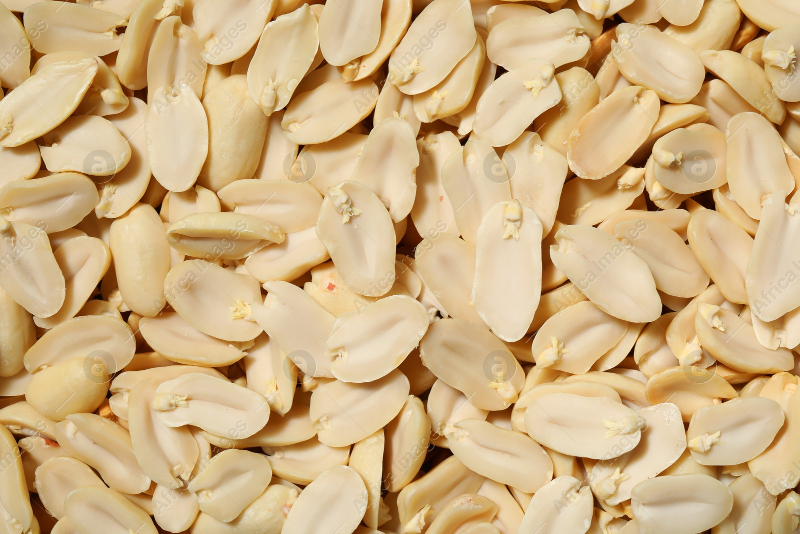 Photo of Fresh peeled peanuts as background, top view