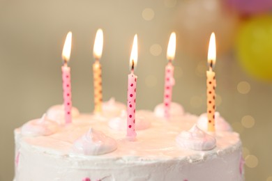 Photo of Tasty Birthday cake with burning candles against blurred background, closeup