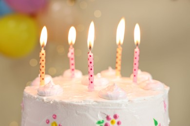 Photo of Tasty Birthday cake with burning candles against blurred background, closeup
