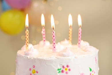 Tasty Birthday cake with burning candles against blurred background, closeup