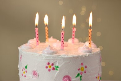 Tasty Birthday cake with burning candles against blurred background, closeup