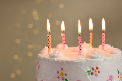 Photo of Tasty Birthday cake with burning candles against blurred background, closeup