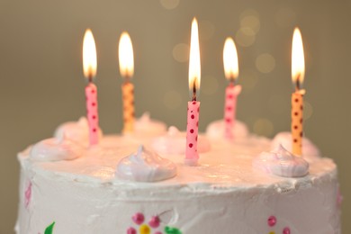 Tasty Birthday cake with burning candles against blurred background, closeup