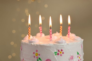 Tasty Birthday cake with burning candles against blurred background, closeup