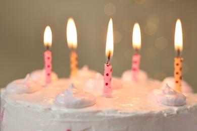 Photo of Tasty Birthday cake with burning candles against blurred background, closeup