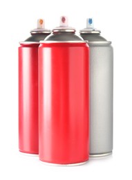 Photo of Many spray paint cans isolated on white