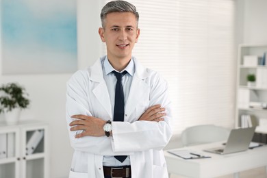 Portrait of doctor with crossed arms in clinic
