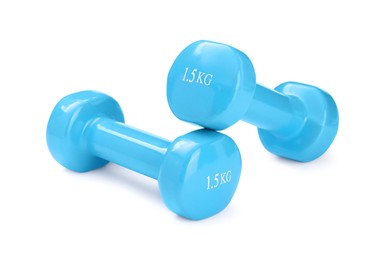 Photo of Light blue dumbbells isolated on white. Sports equipment