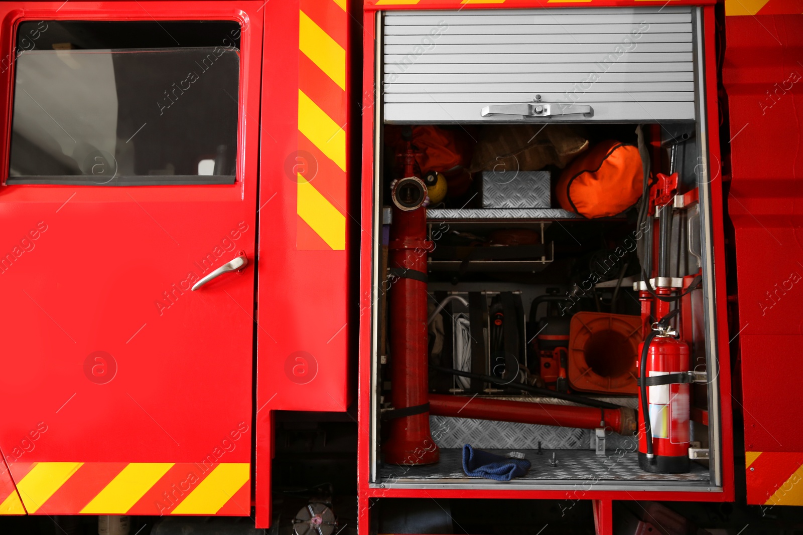 Photo of Red fire truck with safety equipment at station