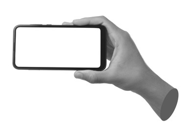 Image of Man's hand holding mobile phone with empty screen isolated on white. Black and white effect