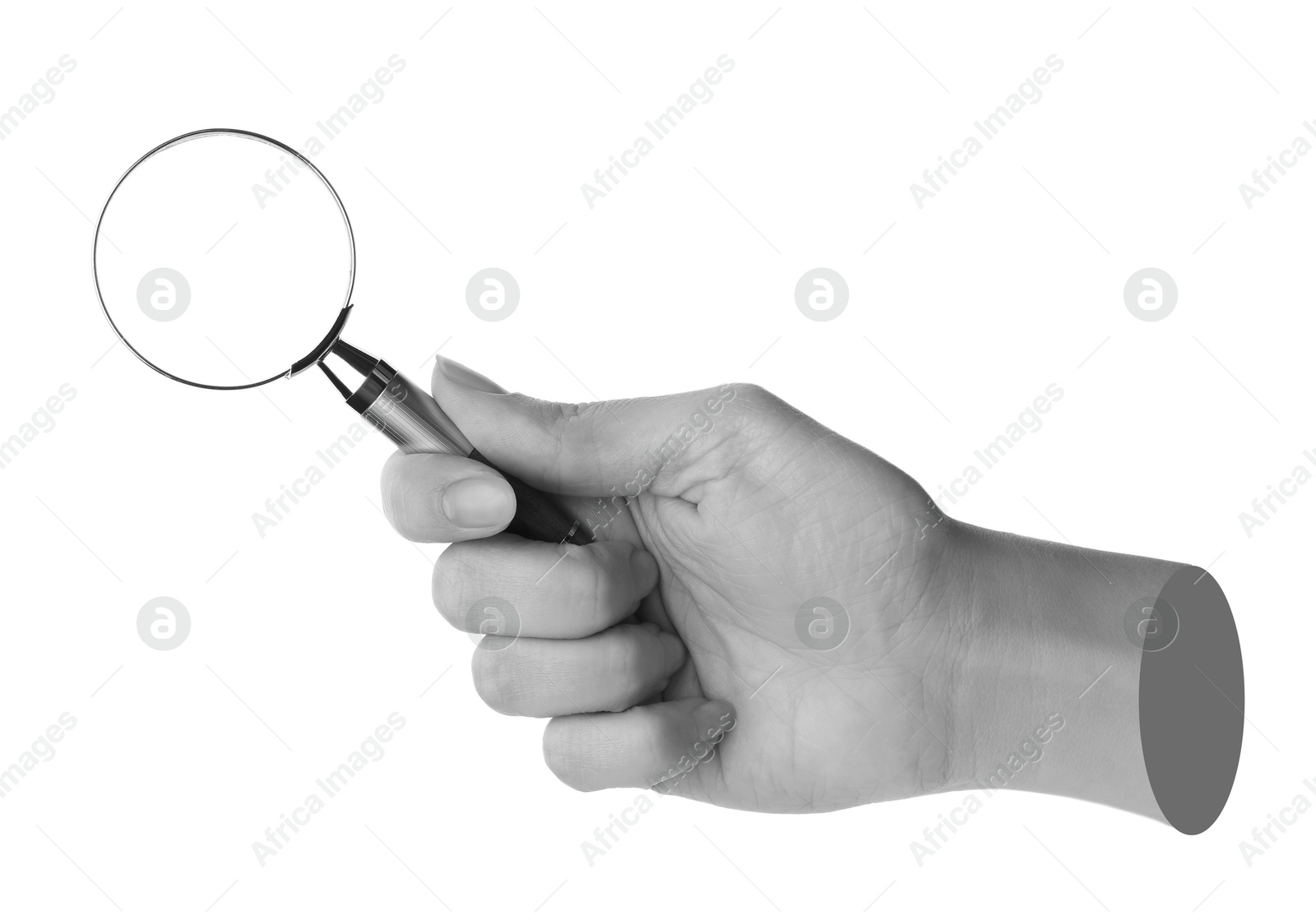 Image of Woman's hand with magnifying glass on white background. Black and white effect