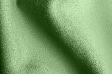 Beautiful sage green fabric as background, closeup