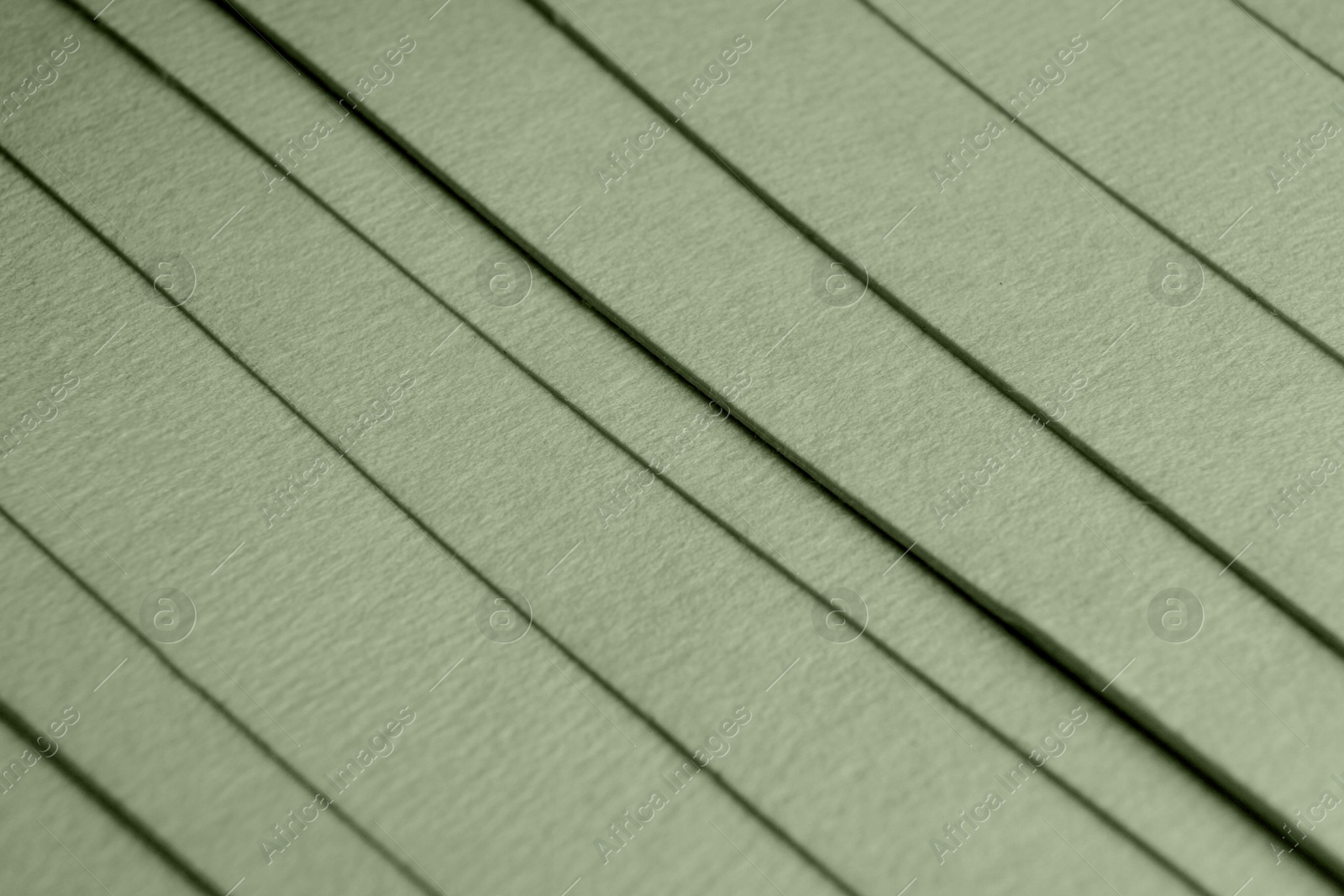 Image of Sage green paper sheets as background, closeup