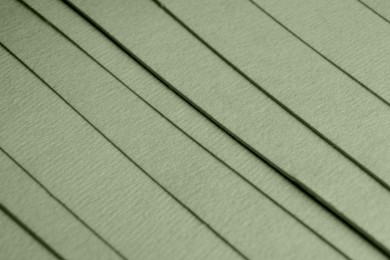 Sage green paper sheets as background, closeup