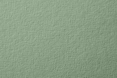 Image of Sage green paper sheet as background, closeup