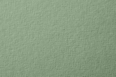 Sage green paper sheet as background, closeup