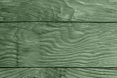 Sage green wooden surface as background, closeup