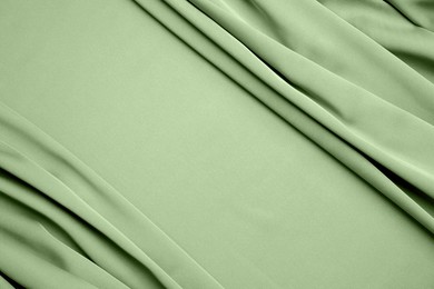 Image of Beautiful sage green fabric as background, closeup