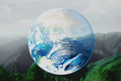 Image of Save the planet. Beautiful mountains and planet Earth, double exposure