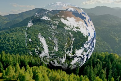 Image of Save the planet. Beautiful mountains and planet Earth, double exposure