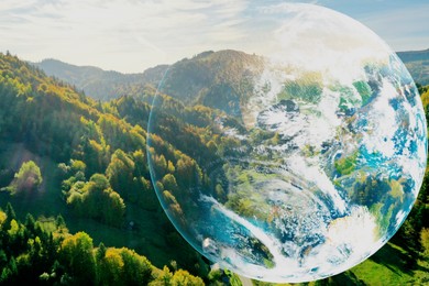 Image of Save the planet. Beautiful mountains and planet Earth, double exposure