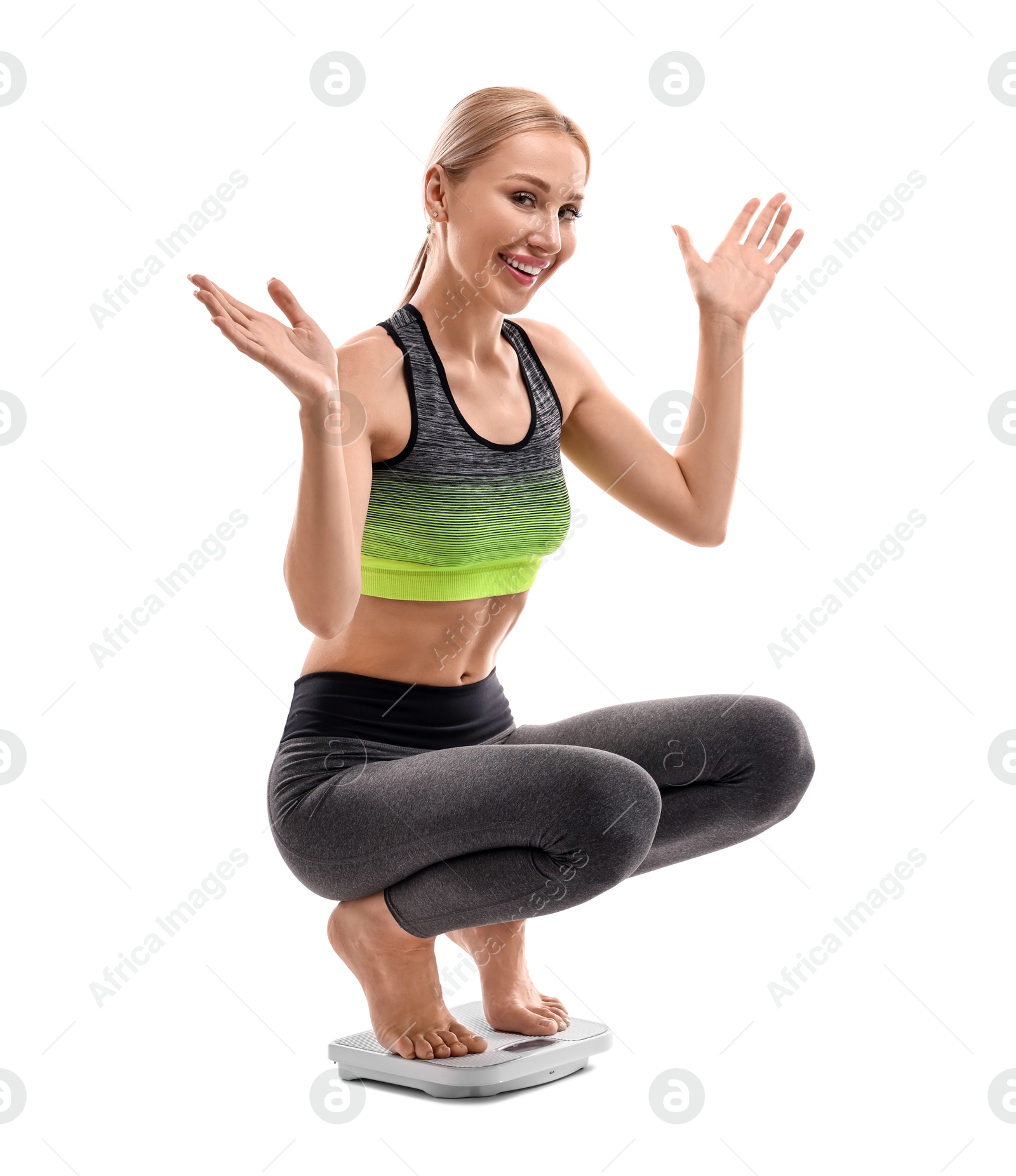 Photo of Happy woman on floor scale against white background