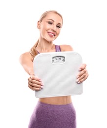 Happy woman with floor scale on white background