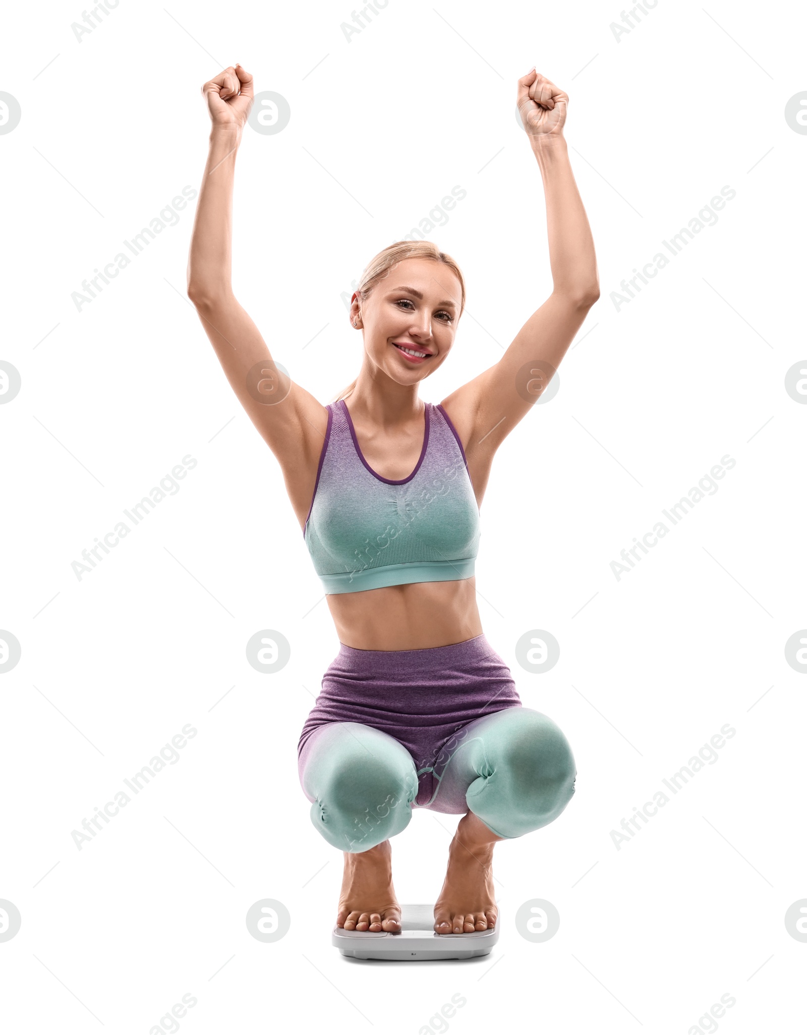 Photo of Happy woman on floor scale against white background