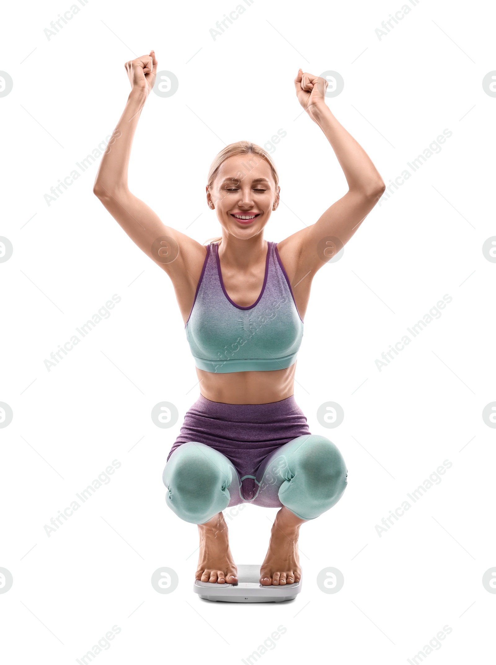 Photo of Happy woman on floor scale against white background