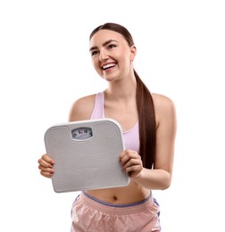 Happy woman with floor scale on white background