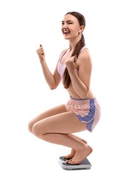 Photo of Happy woman on floor scale against white background