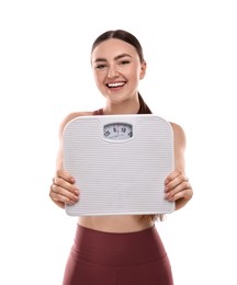 Happy woman with floor scale on white background