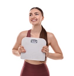 Happy woman with floor scale on white background