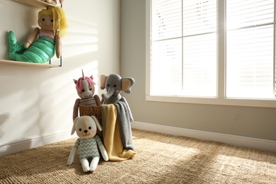 Many cute toys indoors. Baby room interior elements