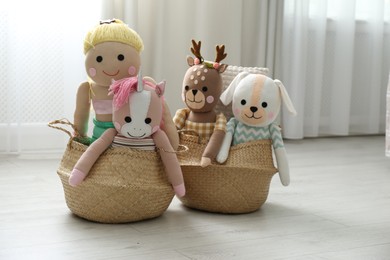 Photo of Funny stuffed toys in baskets on floor. Decor for children's room interior