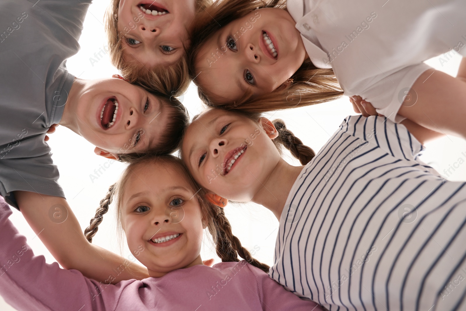 Photo of Group of cute little children indoors, bottom view