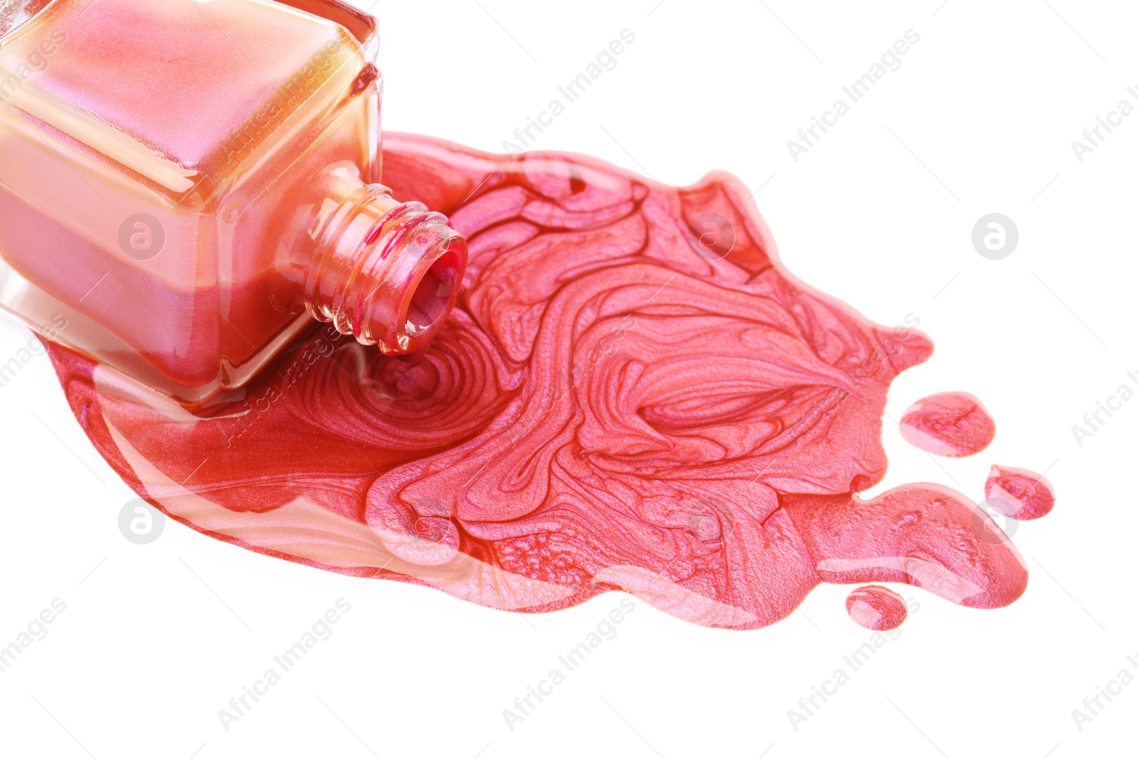 Photo of Overturned bottle of bright nail polish on white background, closeup