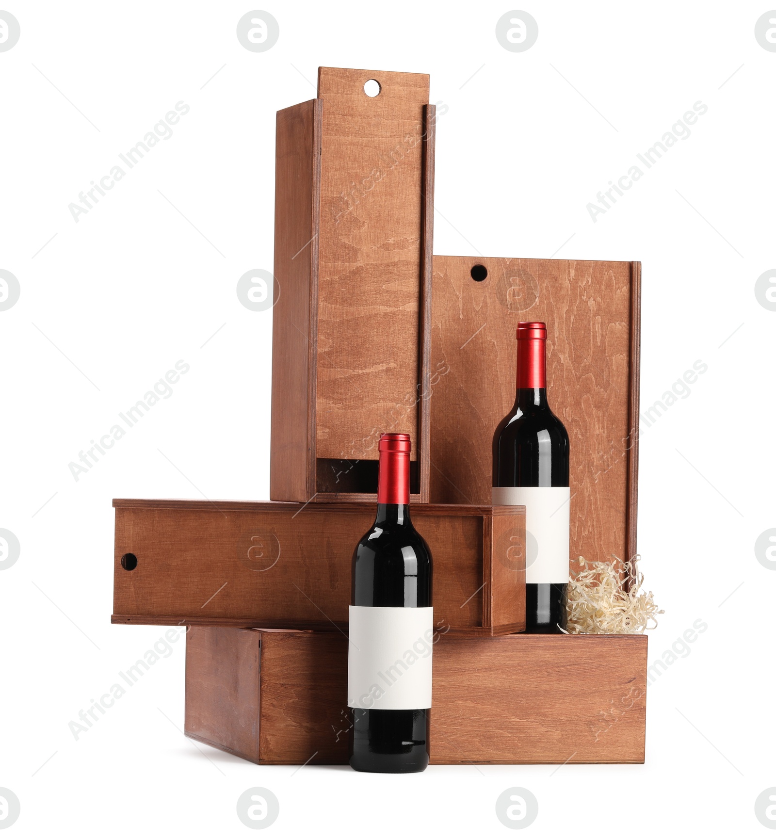 Photo of Wooden gift boxes with wine bottles isolated on white