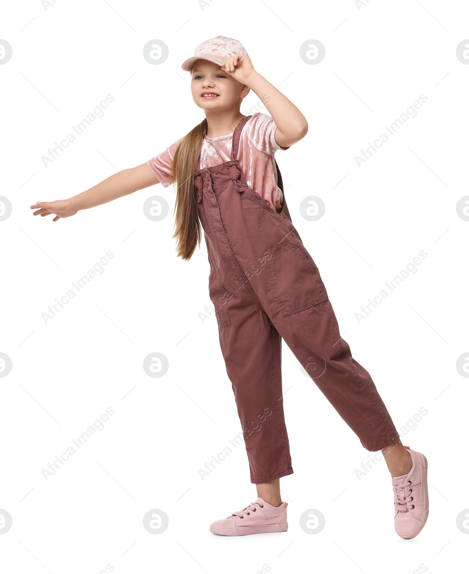 Photo of Cute little girl dancing on white background