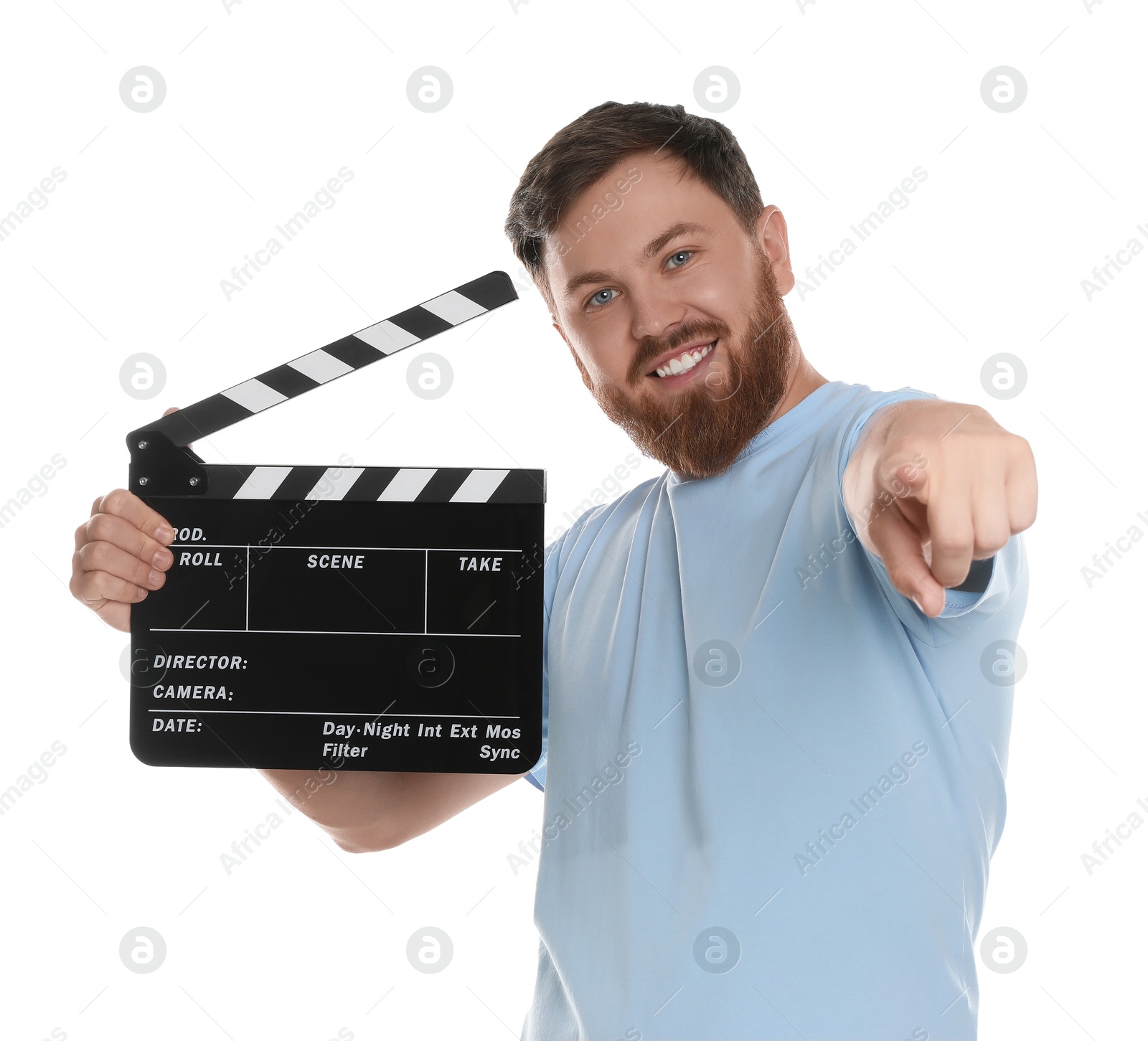 Photo of Making movie. Smiling man with clapperboard pointing at camera on white background