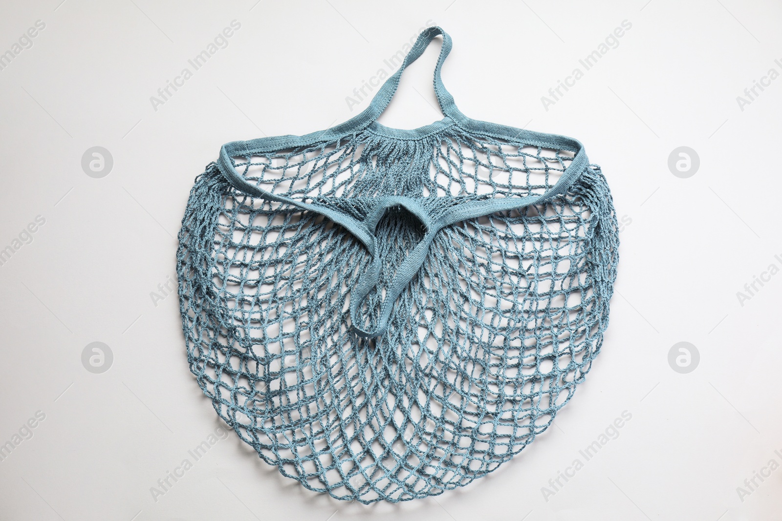 Photo of Blue string bag on light grey background, top view