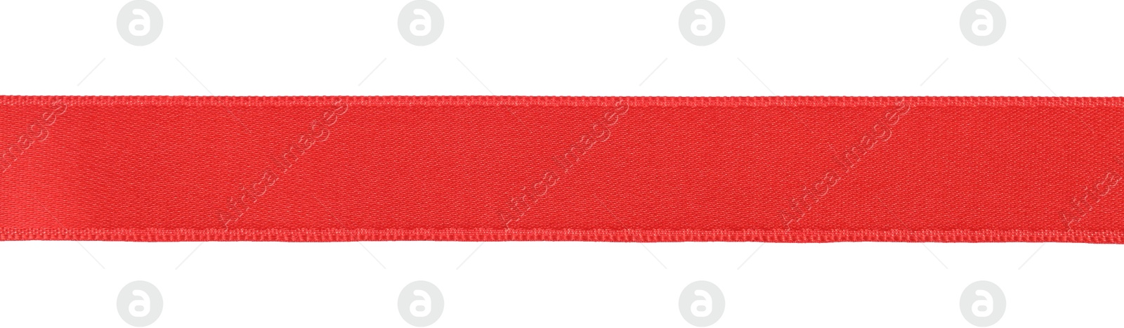 Photo of Beautiful red ribbon isolated on white, top view