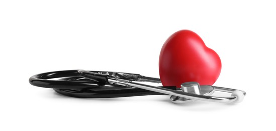 Stethoscope and red heart on wooden table against white background