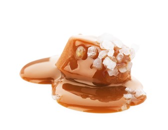 Photo of Yummy candy with caramel sauce and sea salt isolated on white