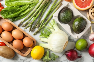 Photo of Many different healthy food on light marble table, flat lay