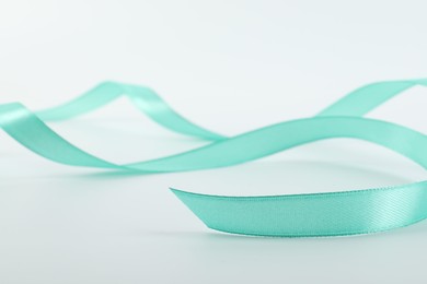 One beautiful turquoise ribbon isolated on white