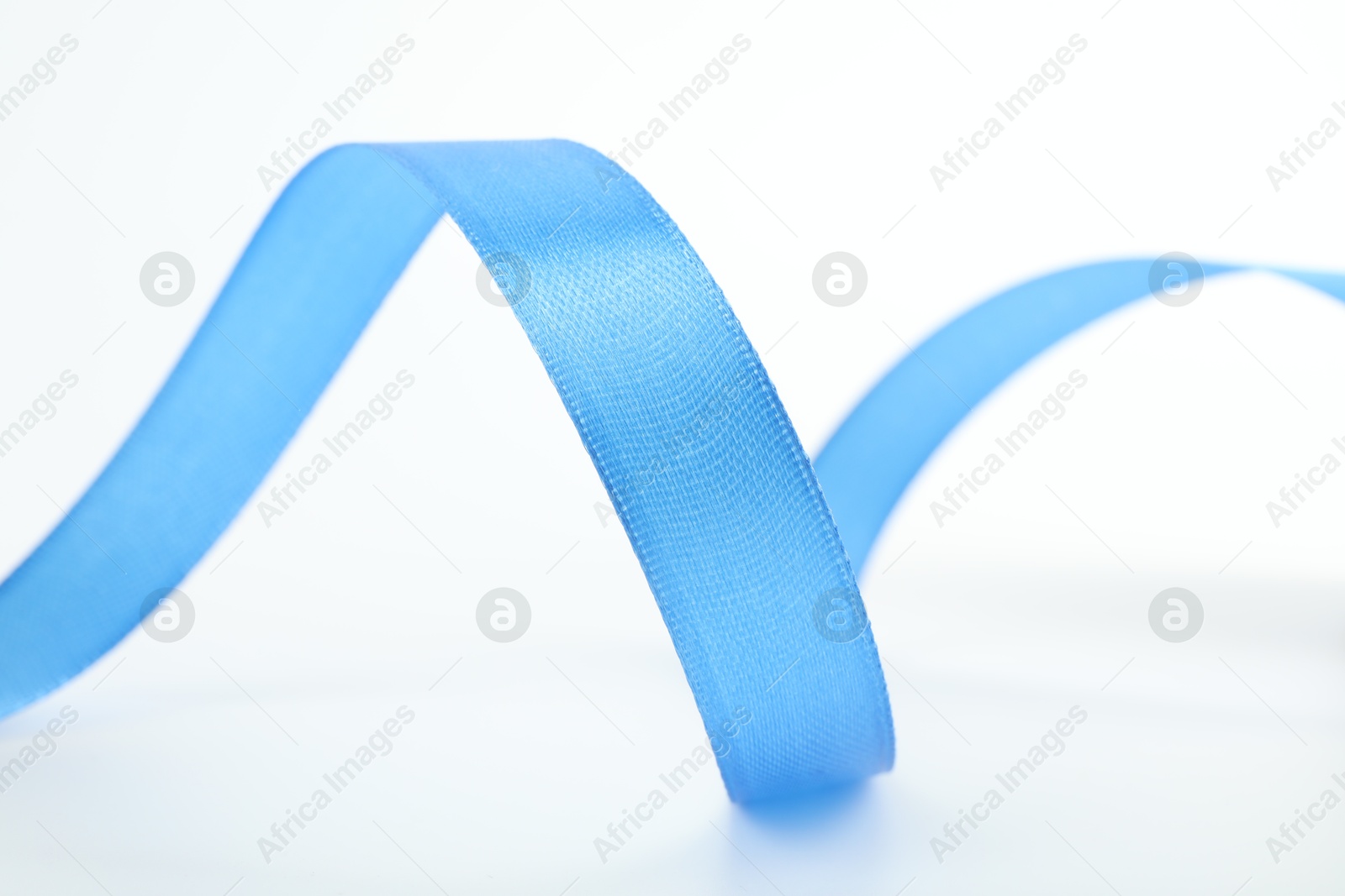 Photo of Beautiful light blue ribbon isolated on white