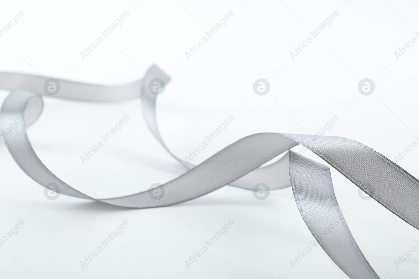 Photo of One beautiful gray ribbon isolated on white