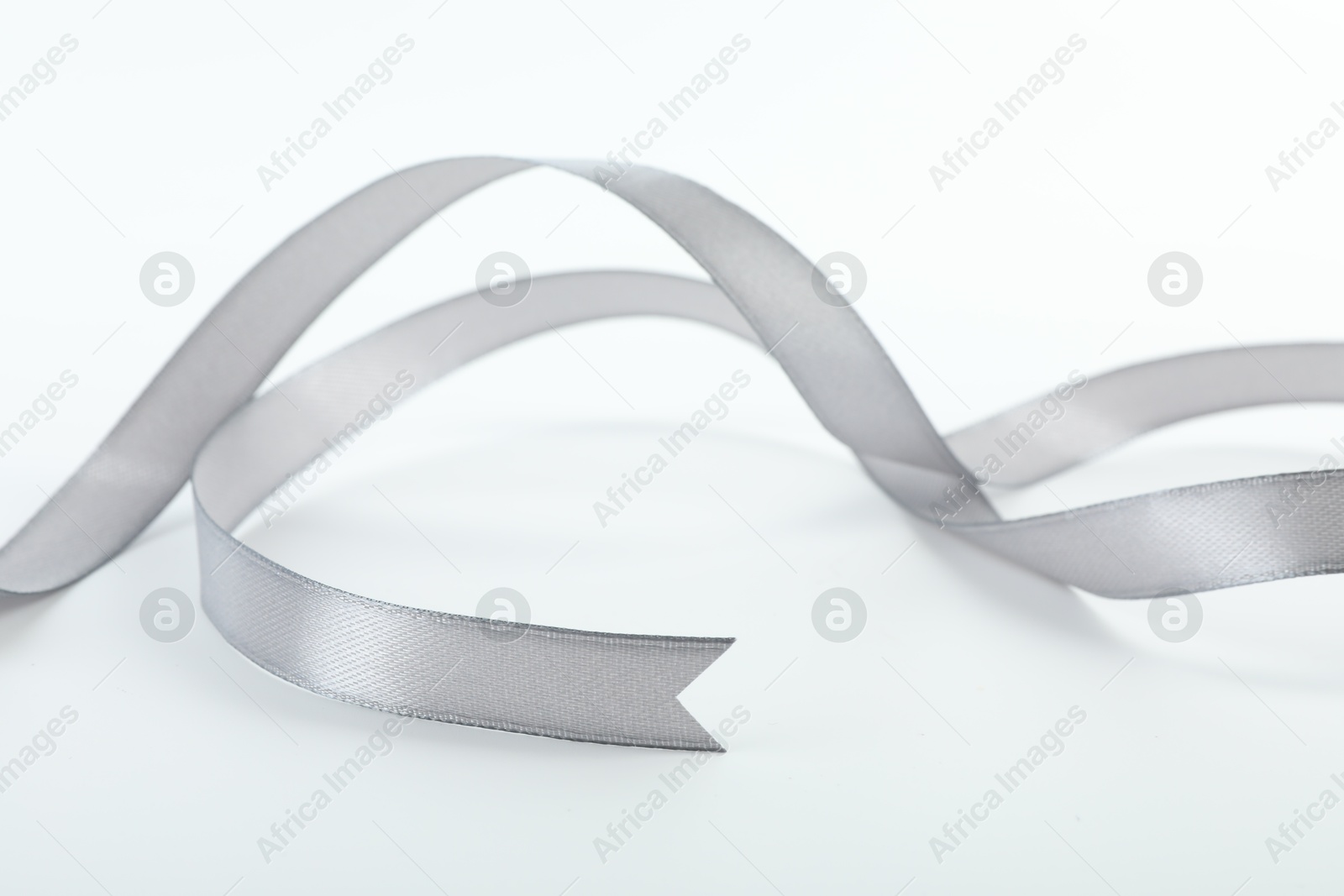 Photo of One beautiful gray ribbon isolated on white